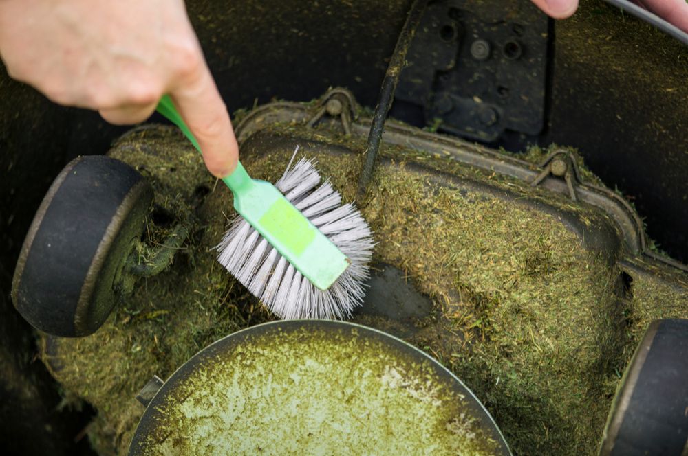 Cleaning Debris From The Mower Deck Prevents Rust And Boosts Performance